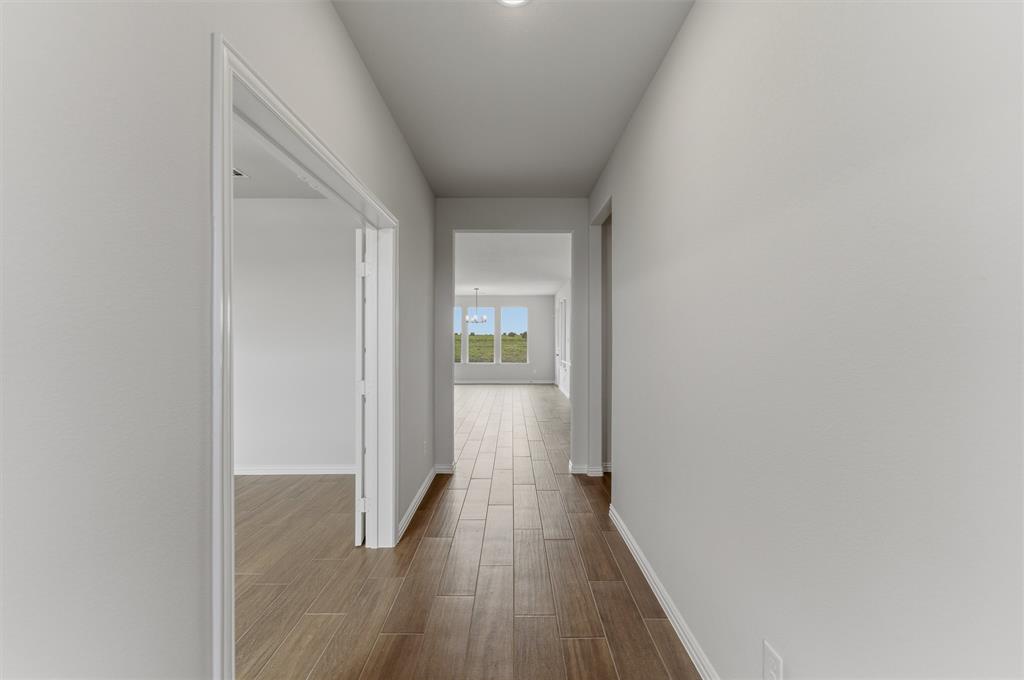 8911 County Road 623 Blue Ridge, TX 75424 - Photo 5 of 28 Corridor featuring dark wood finished floors and baseboards