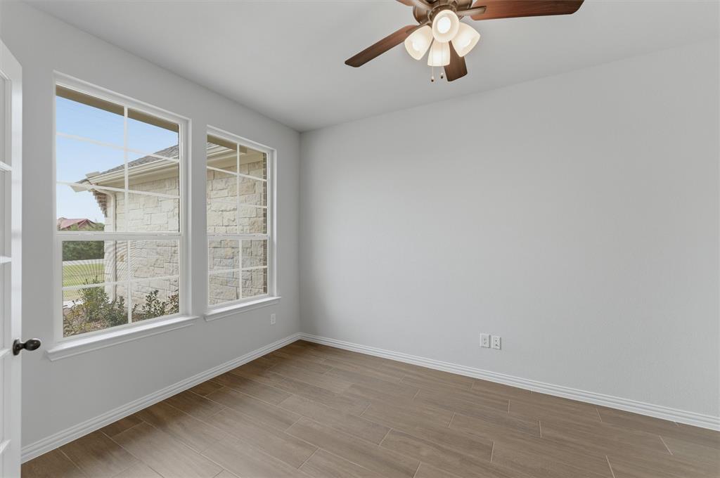 8911 County Road 623 Blue Ridge, TX 75424 - Photo 6 of 28 Spare room with ceiling fan and wood finish floors