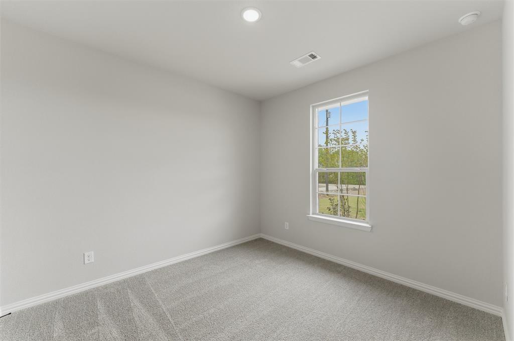 8911 County Road 623 Blue Ridge, TX 75424 - Photo 8 of 28 Empty room featuring light carpet and recessed lighting