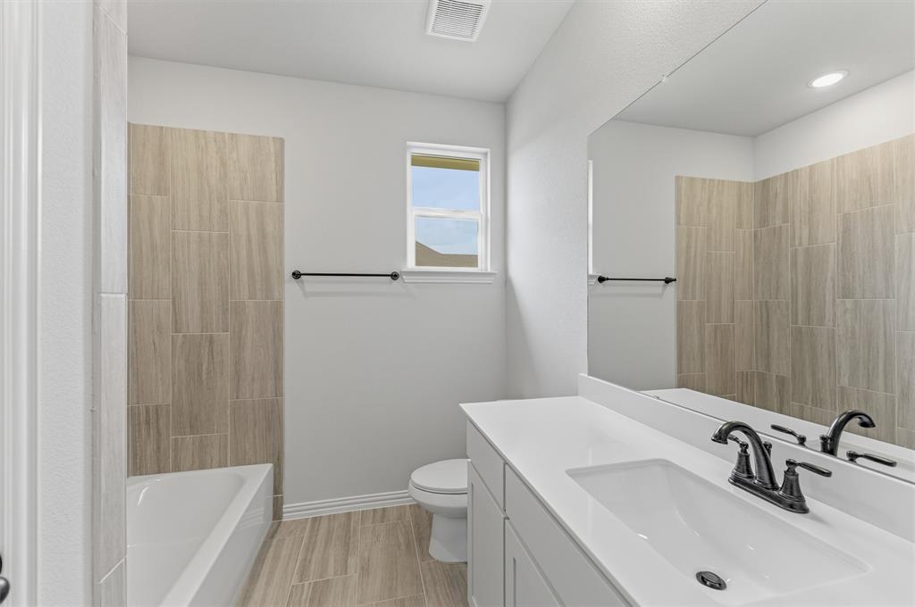8911 County Road 623 Blue Ridge, TX 75424 - Photo 9 of 28 Bathroom featuring vanity and tub / shower combination