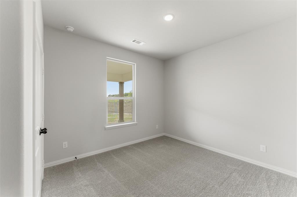 8911 County Road 623 Blue Ridge, TX 75424 - Photo 10 of 28 Empty room with light carpet and baseboards