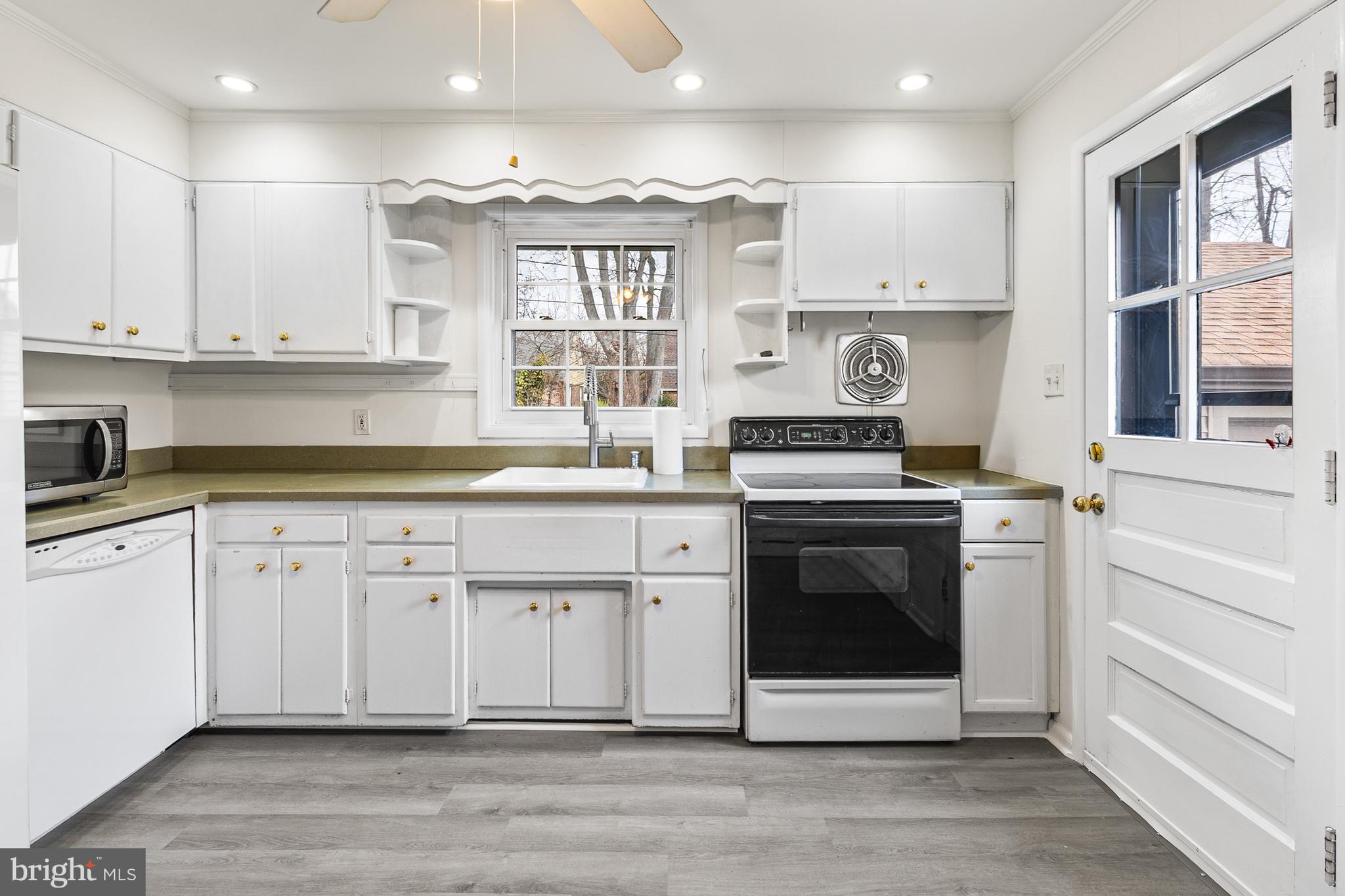 107 Devonshire Road Wilmington, DE 19803 - Photo 12 of 30 Door Leads To Driveway, Garage & Back Patio