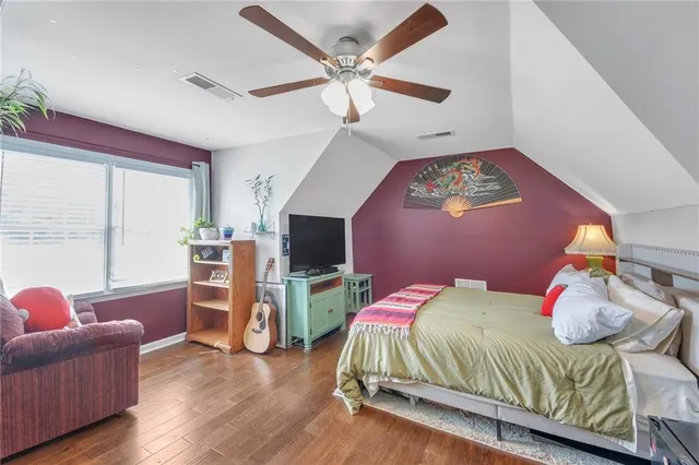 a bedroom with a bed and a couch