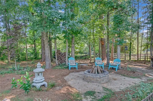 a view of a patio with chairs and plants