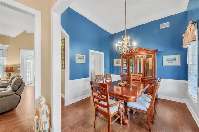 a dining room with furniture and window