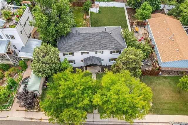 an aerial view of residential houses and outdoor space
