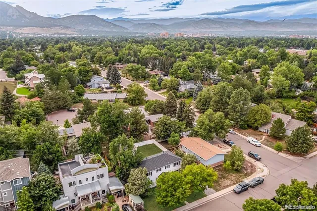 an aerial view of residential houses and outdoor space