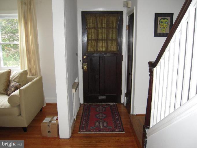 3702 Kimble Road Baltimore, MD 21218 - Photo 4 of 10 a view of an entryway with wooden floor and door