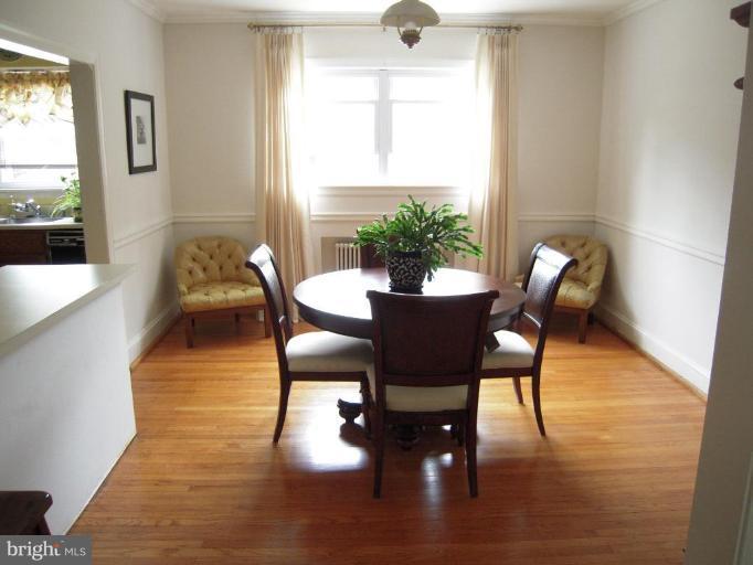 3702 Kimble Road Baltimore, MD 21218 - Photo 5 of 10 a dining room with furniture and wooden floor