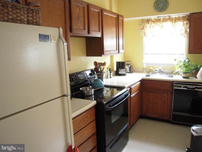 3702 Kimble Road Baltimore, MD 21218 - Photo 7 of 10 a kitchen with a sink appliances and cabinets