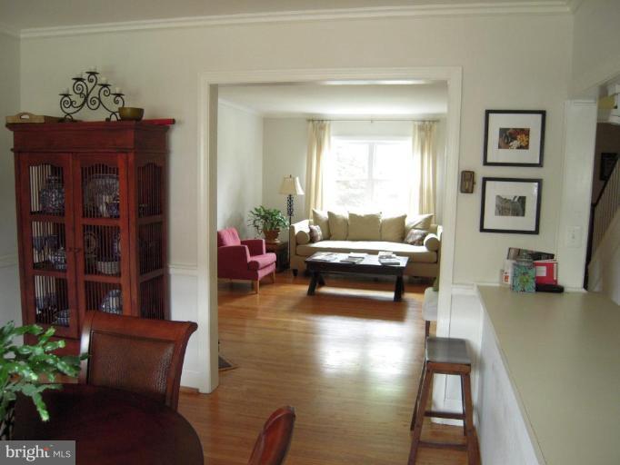 3702 Kimble Road Baltimore, MD 21218 - Photo 9 of 10 a living room with furniture and wooden floor