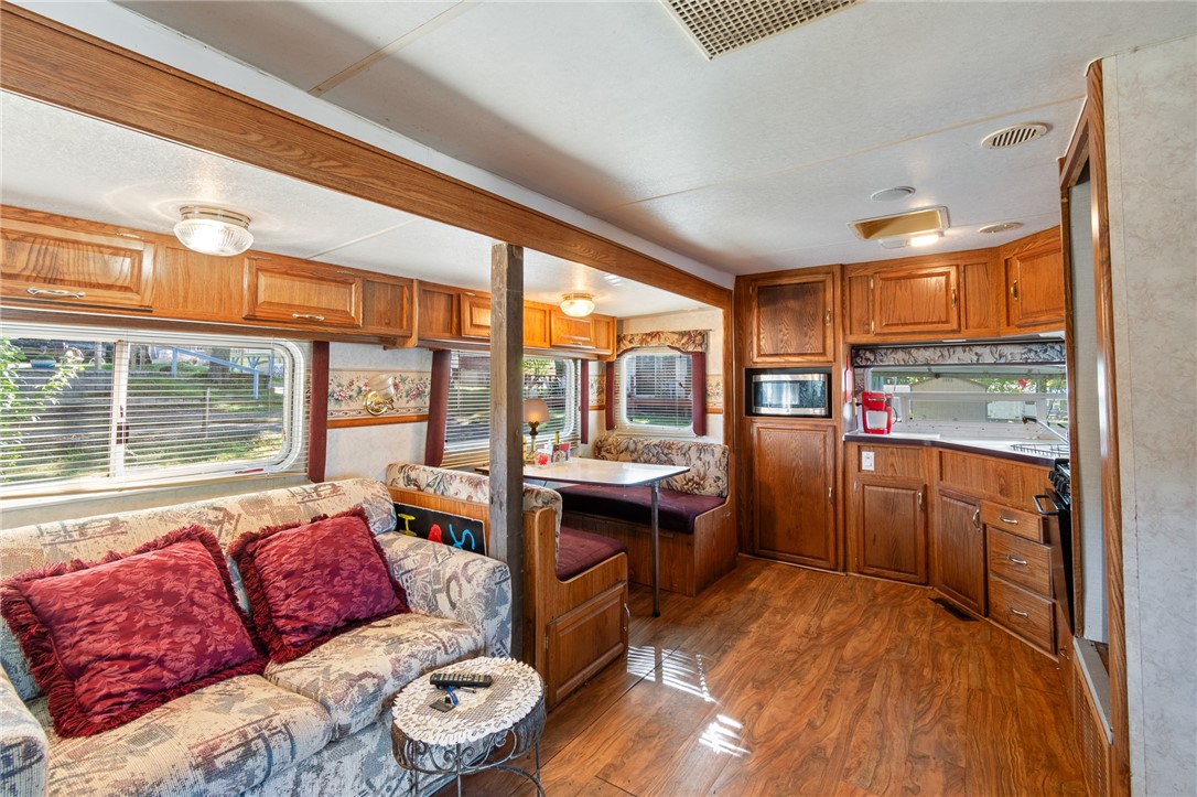 7945 Lake Road, Unit 16 Sodus, NY 14555 - Photo 12 of 20 The living room seating area- adjacent to the kitc