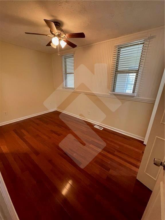 4267 Grogan Street Acworth, GA 30101 - Photo 27 of 37 a view of a big room with wooden floor and a ceiling fan