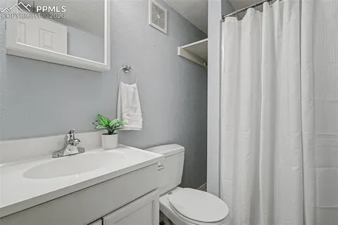a bathroom with a sink and toilet