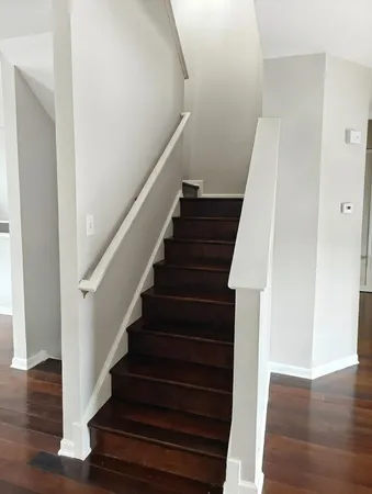 a view of entryway with wooden floor