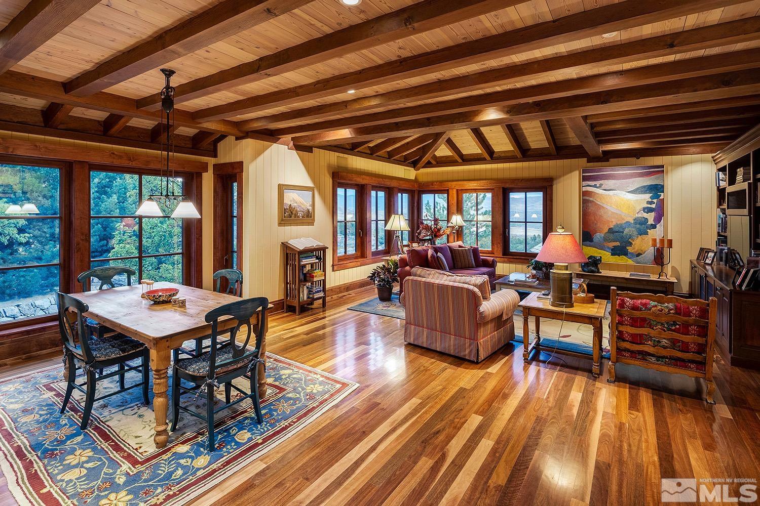 95 Bear Mountain Place Reno, NV 89519 - Photo 15 of 33 a living room with furniture a table tennis table and a floor to ceiling window