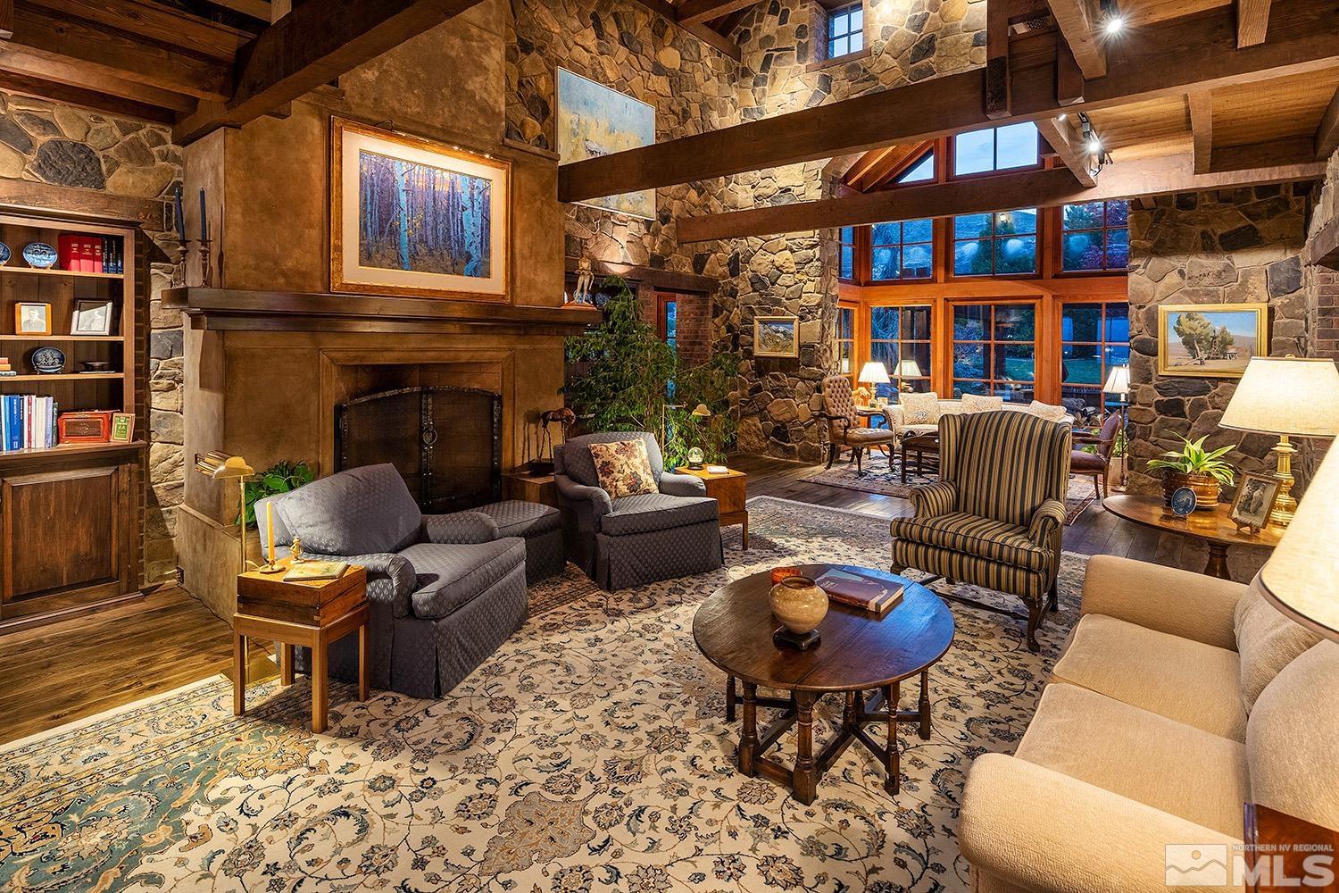 95 Bear Mountain Place Reno, NV 89519 - Photo 3 of 33 a living room with furniture a rug and a fireplace