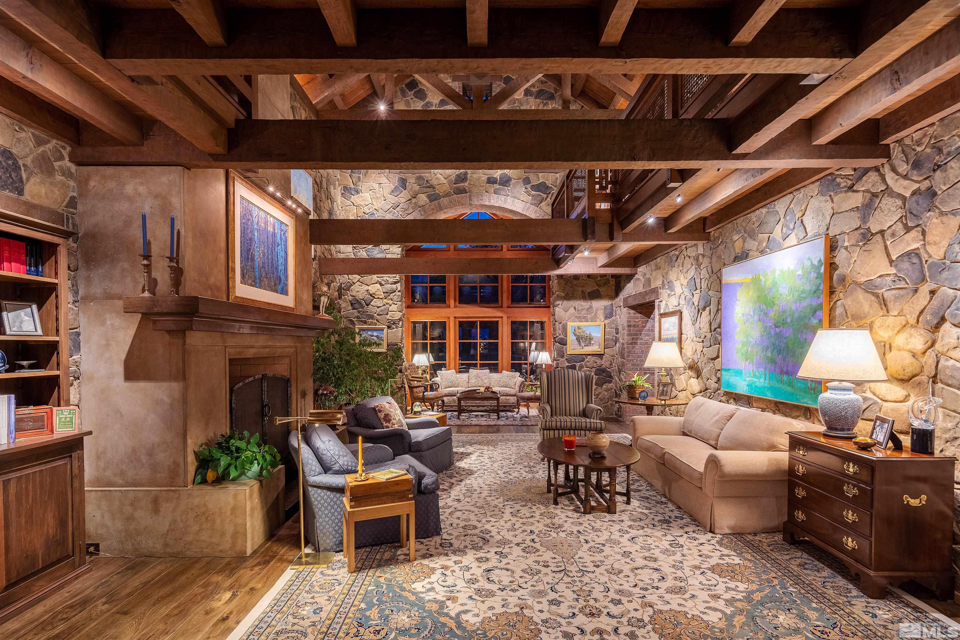 95 Bear Mountain Place Reno, NV 89519 - Photo 5 of 33 a living room with furniture and a fireplace