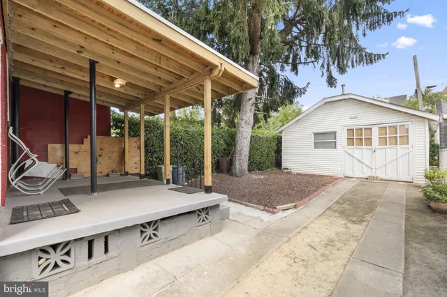 a backyard of a house with seating space