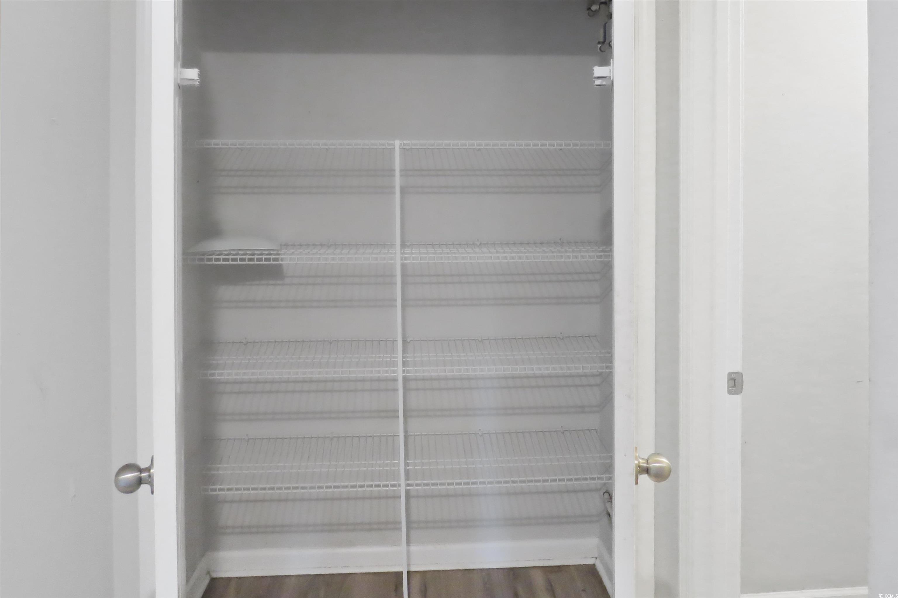 204 Rosedale Drive Aynor, SC 29511 - Photo 23 of 23 Spacious closet in hallway can serve as additional pantry as it's located by the kitchen OR serve as a linen closet.