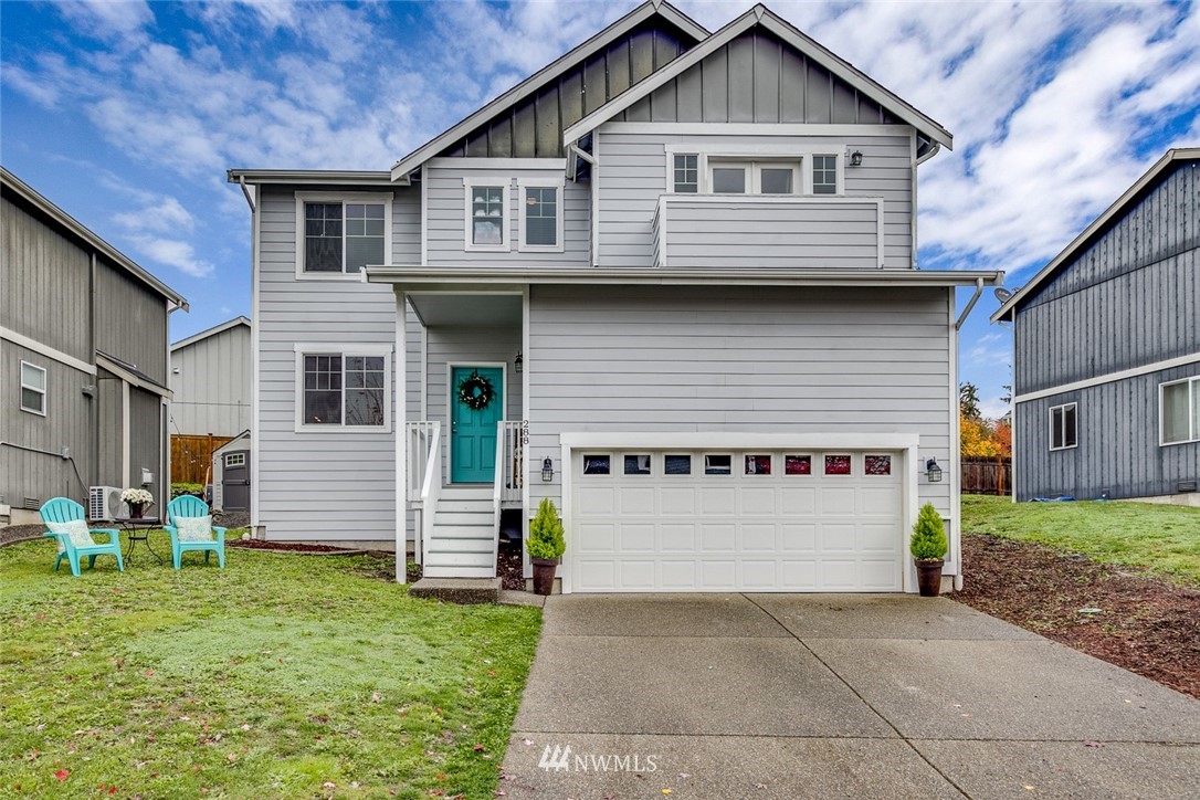 288 East Fulton Way Bremerton, WA 98310 - Photo 1 of 25 a front view of a house with garden