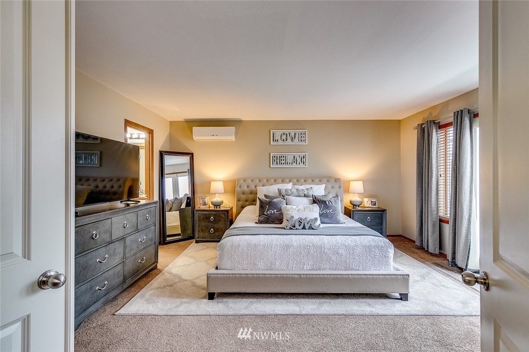 288 East Fulton Way Bremerton, WA 98310 - Photo 14 of 25 a bedroom with a large bed and a flat screen tv