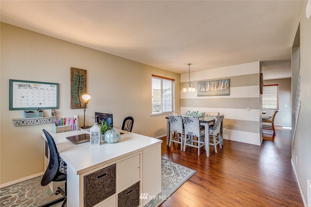 288 East Fulton Way Bremerton, WA 98310 - Photo 3 of 25 a view of a dining room with furniture and wooden floor