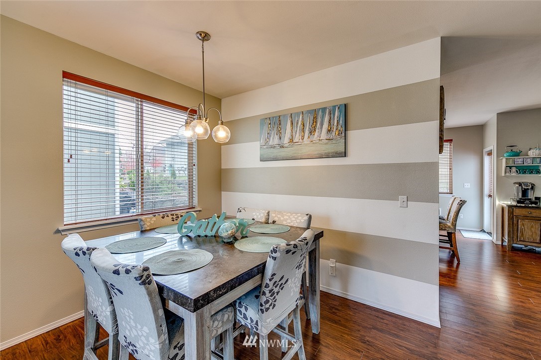 288 East Fulton Way Bremerton, WA 98310 - Photo 4 of 25 a view of a dining room with furniture window and wooden floor