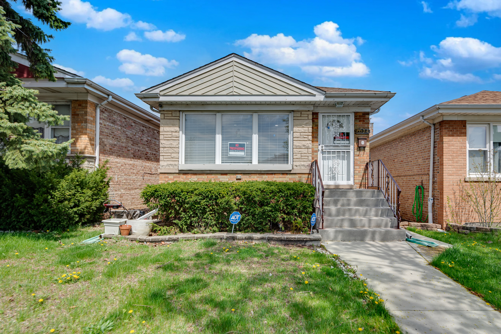 7004 West Foster Avenue Chicago, IL 60656 - Photo 1 of 16 front view of a house with a yard