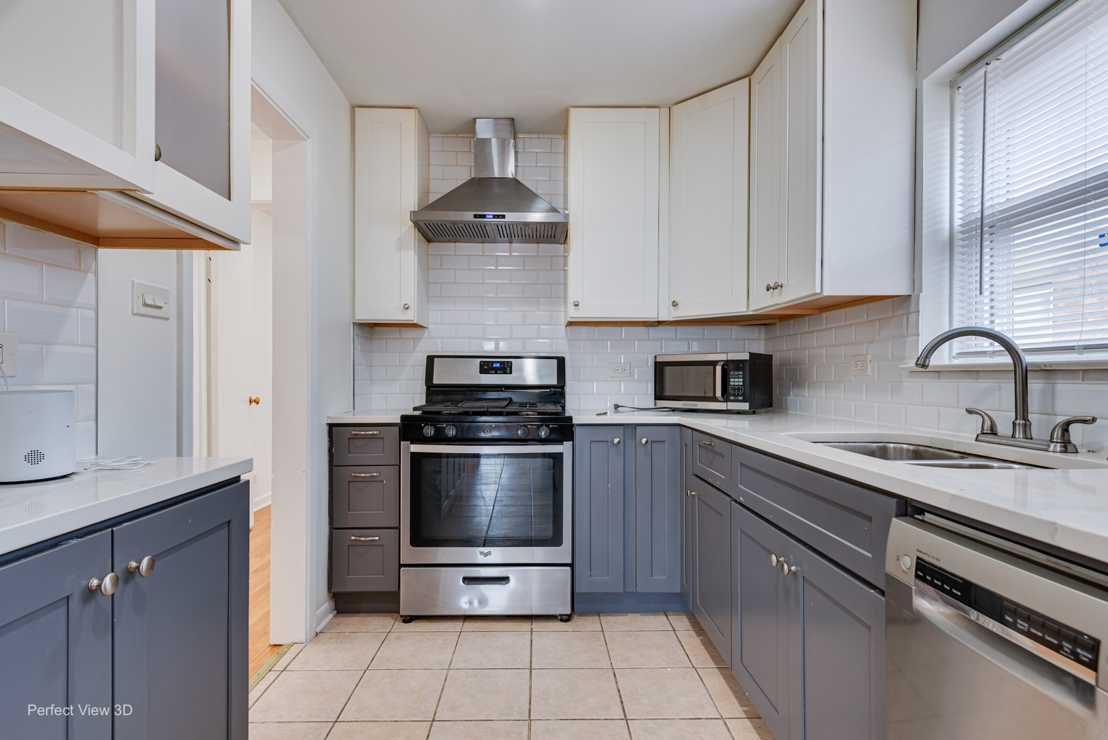 7004 West Foster Avenue Chicago, IL 60656 - Photo 13 of 16 a kitchen with stainless steel appliances a sink a stove and cabinets