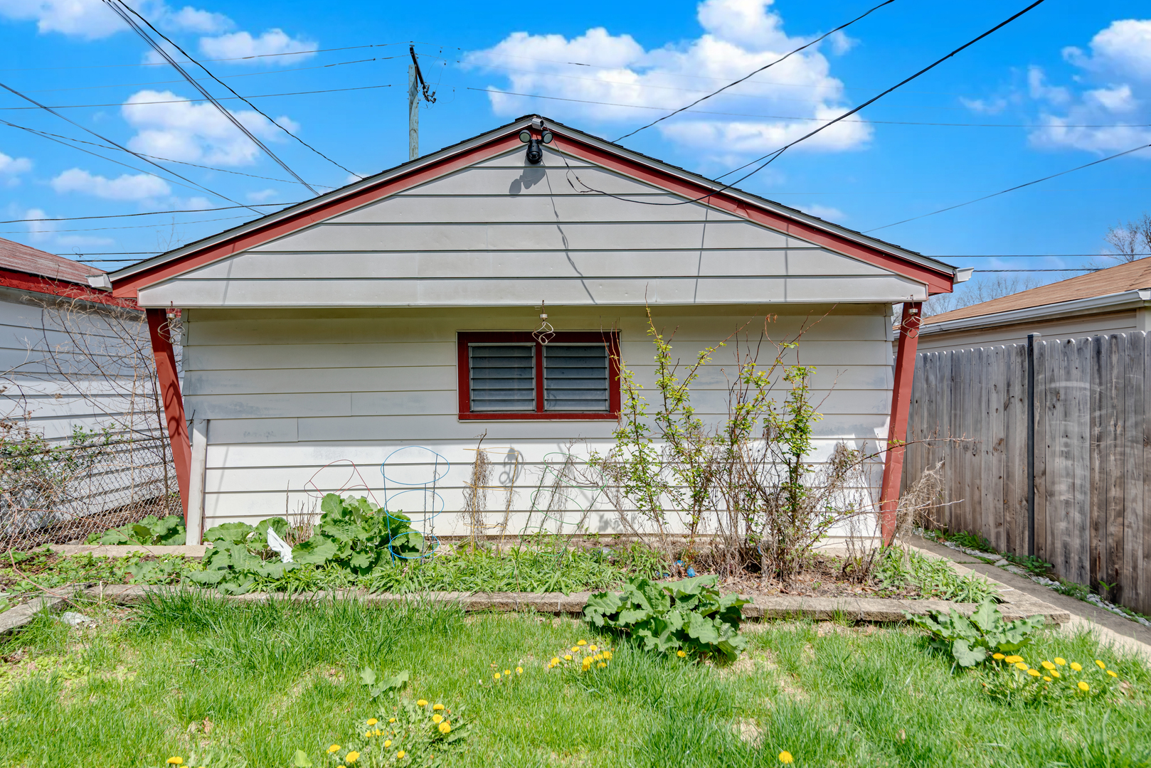 7004 West Foster Avenue Chicago, IL 60656 - Photo 16 of 16 a front view of a house with garden