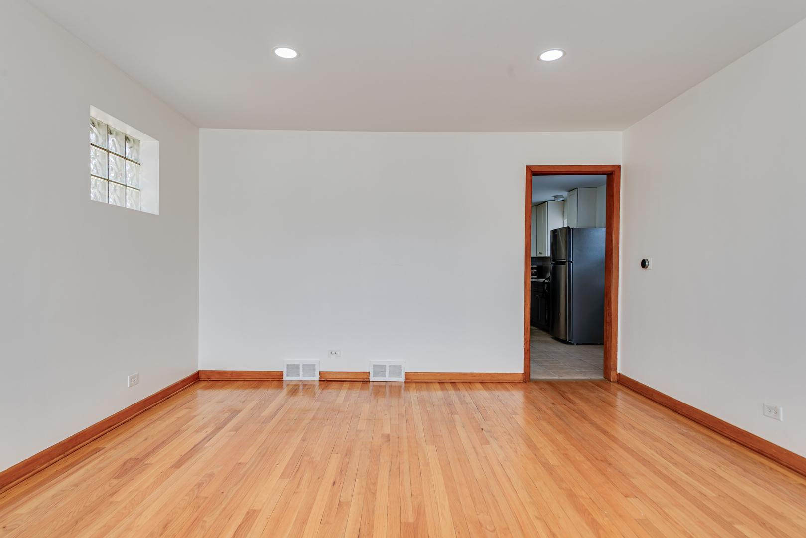 7004 West Foster Avenue Chicago, IL 60656 - Photo 4 of 16 an empty room with wooden floor and closet