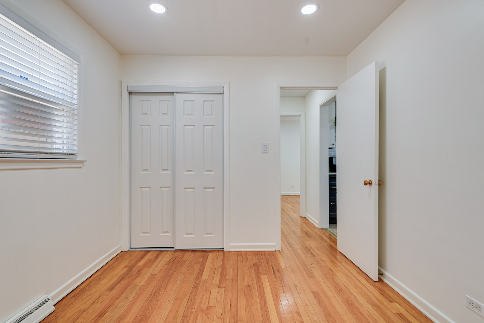 7004 West Foster Avenue Chicago, IL 60656 - Photo 6 of 16 a view of a hallway with wooden floor