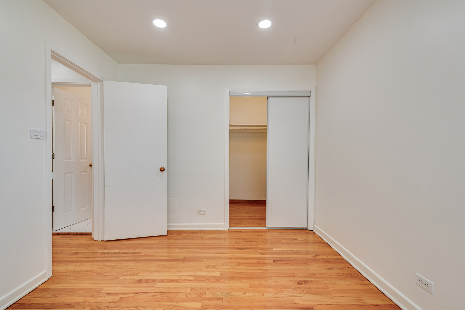 7004 West Foster Avenue Chicago, IL 60656 - Photo 10 of 16 a view of an empty room with wooden floor