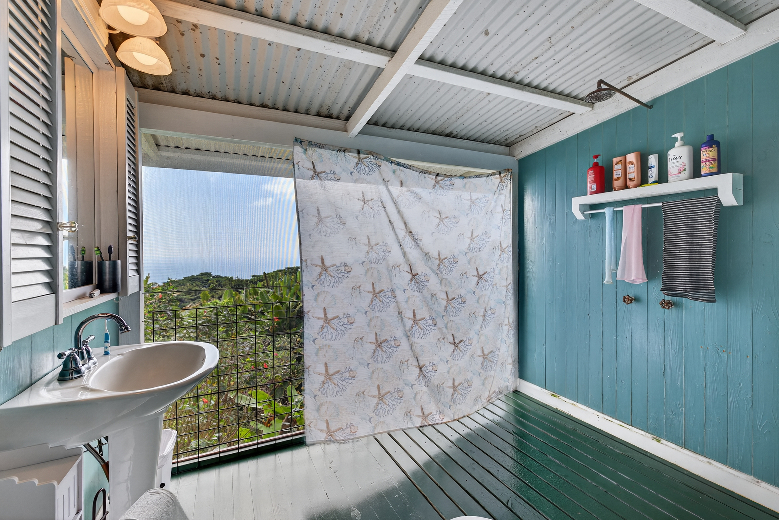 83-5531 Hawaii Belt Road Captain Cook, HI 96704 - Photo 16 of 30 a bathroom with a sink and a mirror