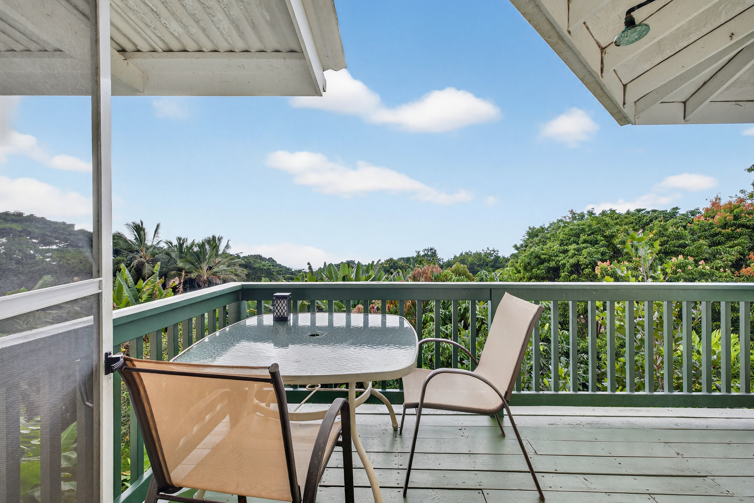 83-5531 Hawaii Belt Road Captain Cook, HI 96704 - Photo 21 of 30 a view of a chairs on the roof deck