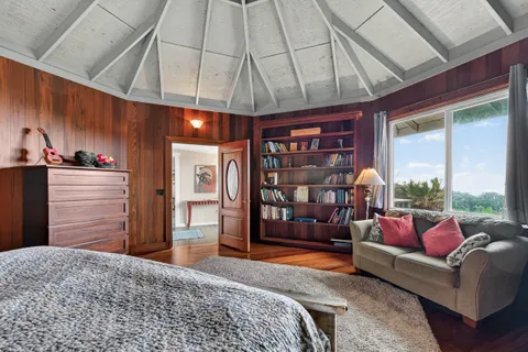 an aerial view of a house with yard and outdoor seating