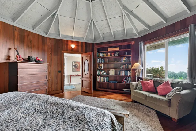 a aerial view of a house with a yard table and chairs