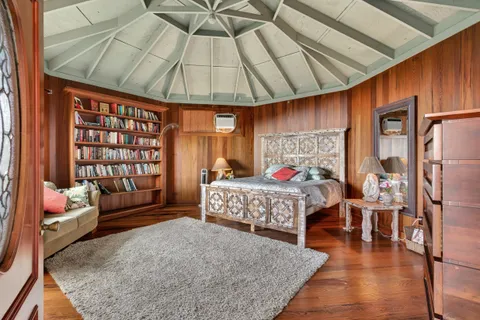 a bedroom with a bed and a walk in closet