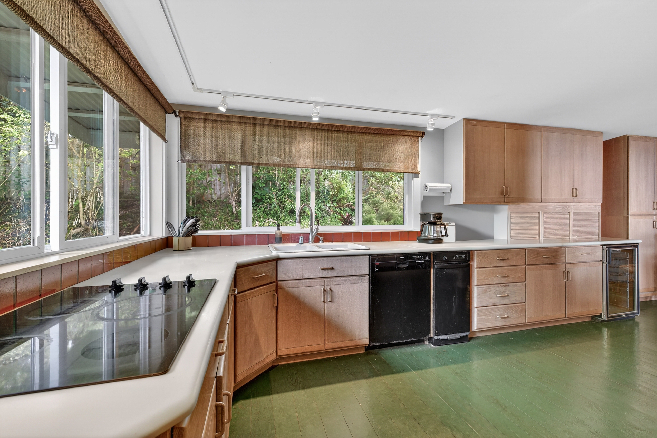 83-5531 Hawaii Belt Road Captain Cook, HI 96704 - Photo 9 of 30 a kitchen with stainless steel appliances granite countertop a stove a sink and a refrigerator