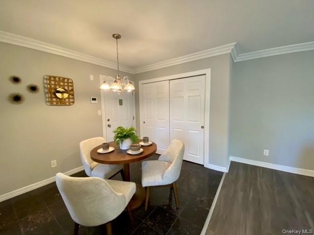 307 Robinson Avenue, Unit 5 Patchogue, NY 11772 - Photo 3 of 9 a view of a dining room with furniture and wooden floor