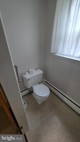 a view of walk in closet with wooden floor