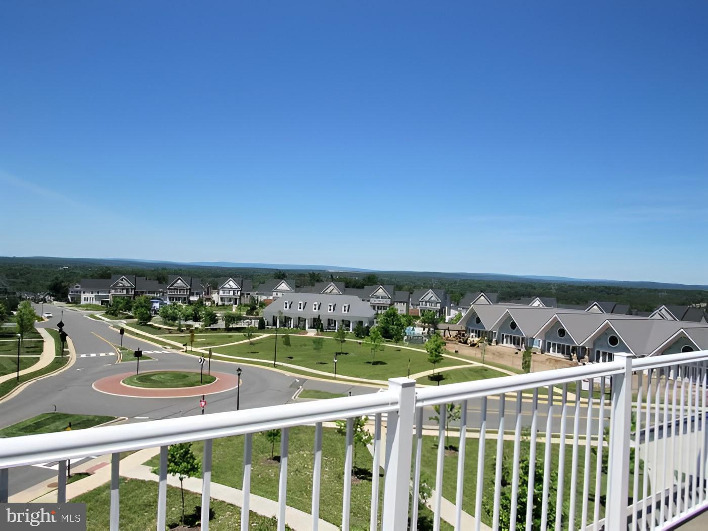 42581 Sunset Ridge Square Ashburn, VA 20148 - Photo 19 of 24 Scenic suburban vista under blue skies.
