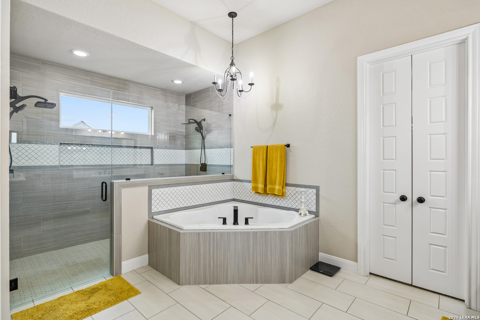 498 Double Gate Road Castroville, TX 78009 - Photo 16 of 28 a bathroom with a tub sink and mirror
