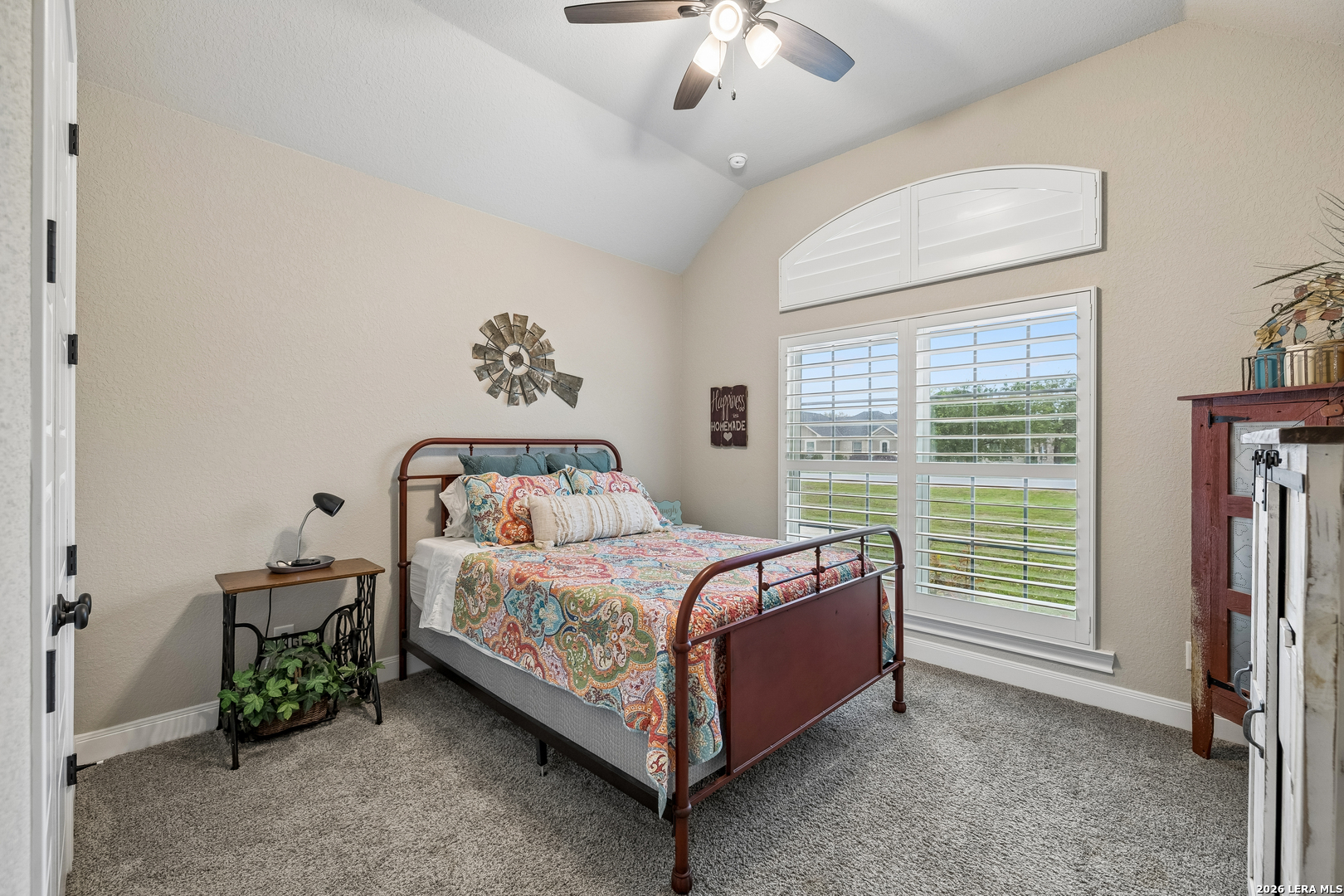 498 Double Gate Road Castroville, TX 78009 - Photo 17 of 28 a bed sitting in a bedroom next to a window