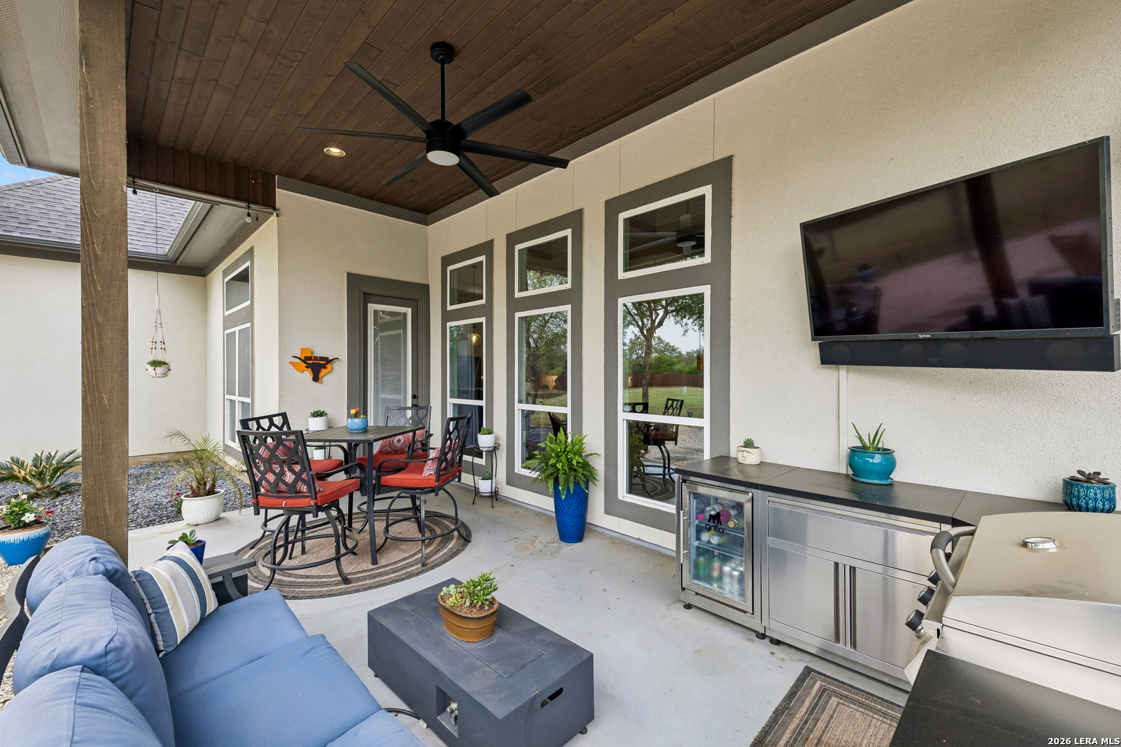 498 Double Gate Road Castroville, TX 78009 - Photo 25 of 28 a living room with furniture and a flat screen tv