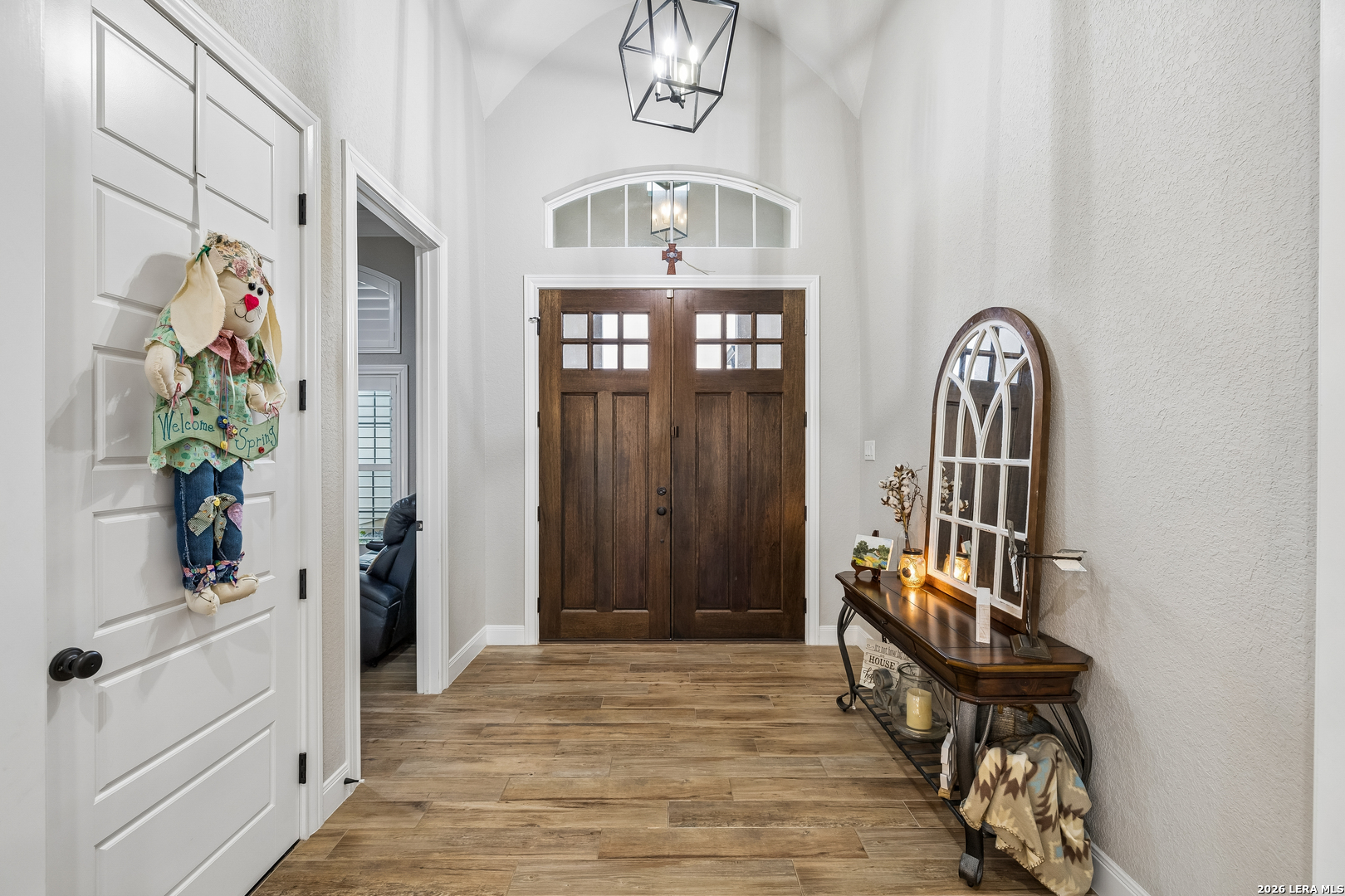 498 Double Gate Road Castroville, TX 78009 - Photo 4 of 28 a view of a hallway to a livingroom with furniture