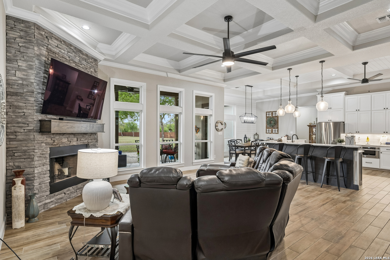 498 Double Gate Road Castroville, TX 78009 - Photo 7 of 28 a living room with fireplace furniture and a flat screen tv