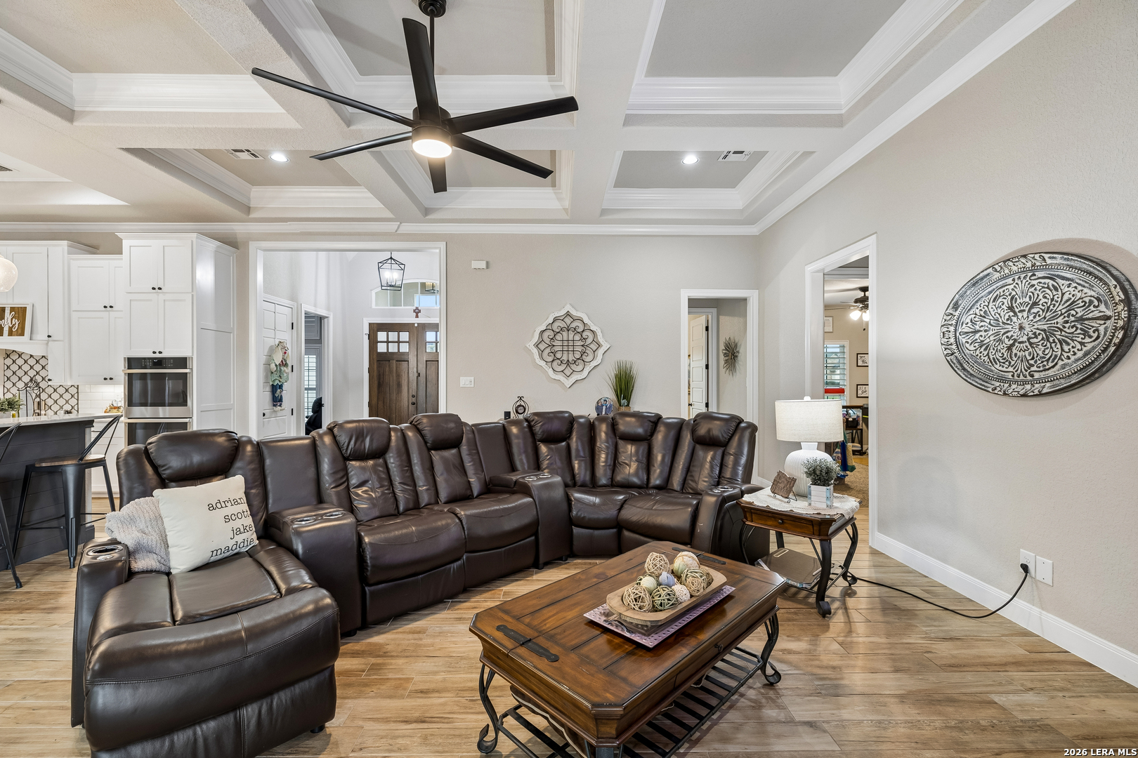 498 Double Gate Road Castroville, TX 78009 - Photo 8 of 28 a living room with furniture a rug and a chandelier