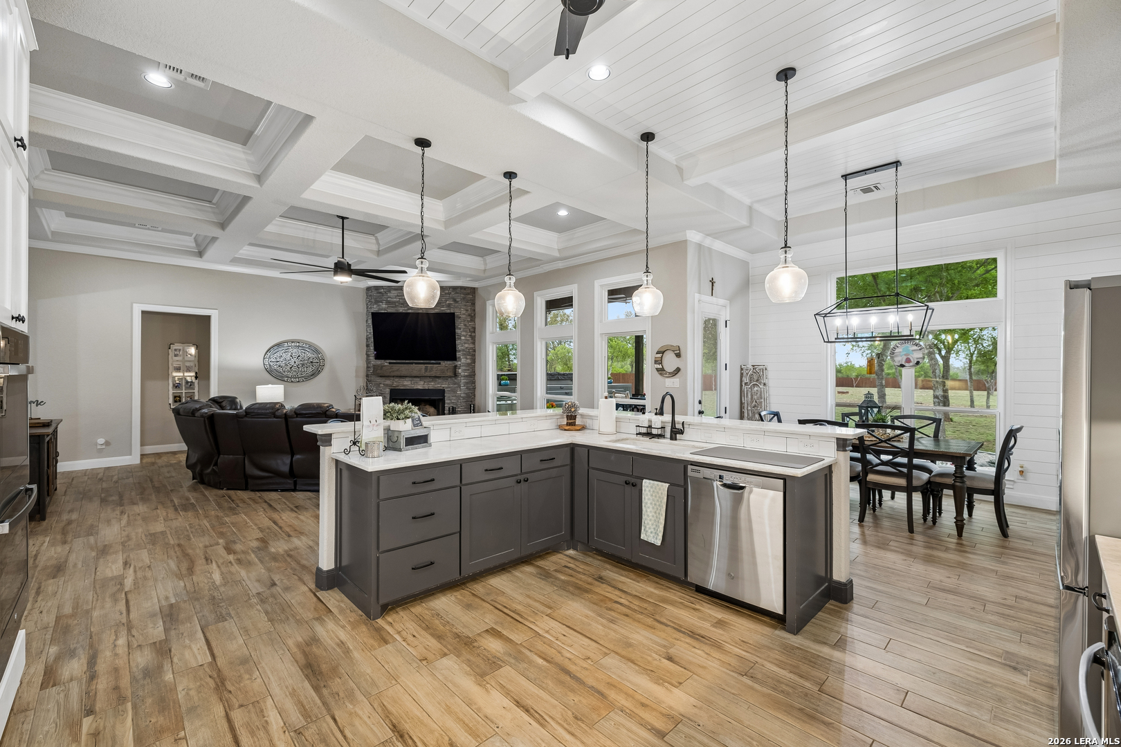 498 Double Gate Road Castroville, TX 78009 - Photo 10 of 28 a kitchen with a sink stove and cabinets